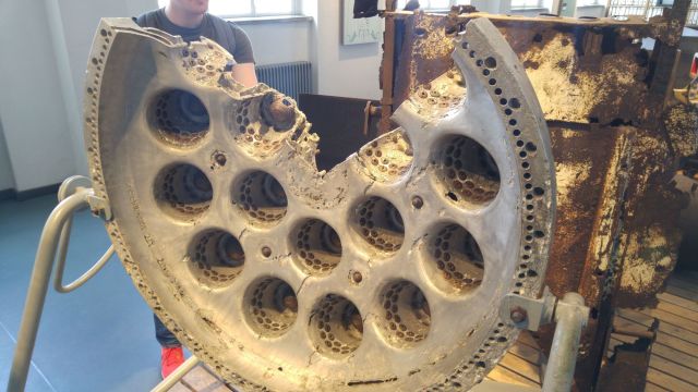 V-2 fuel mixing system. Each hole holds an individually milled brass shower head and about twenty smaller milled brass pieces, spraying a vortex of alcohol fuel and liquid oxygen. All this was powered by a large milled aluminium pump which itself required two more types of fuel. No wonder they lost the war.